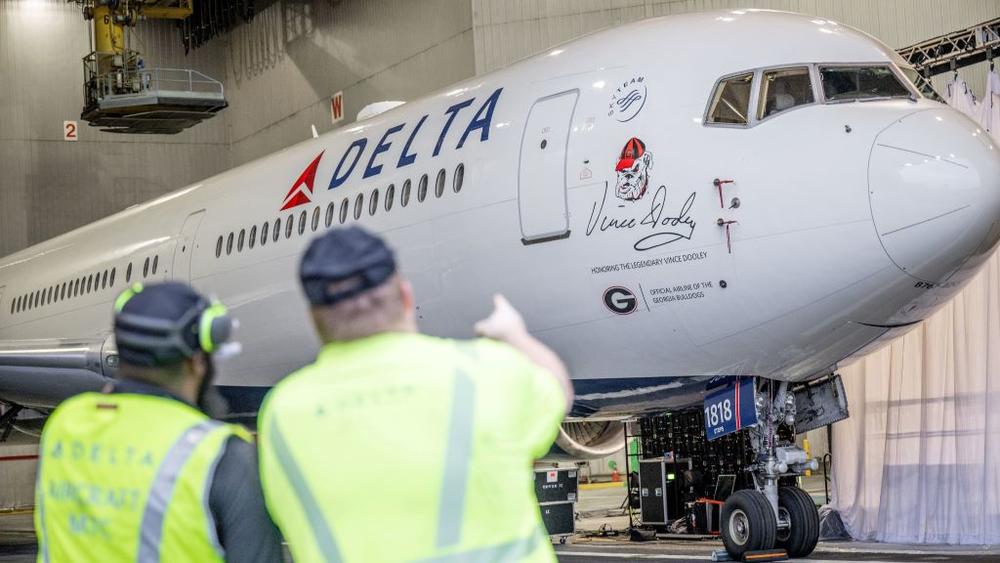 A Delta plane is shown with a UGA Bulldogs logo painted on it.