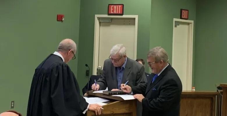 From Left: Judge Anthony L. Harrison swears in Commissioner Jim Goodman and Commissioner Martin Turner Credit: Camden County