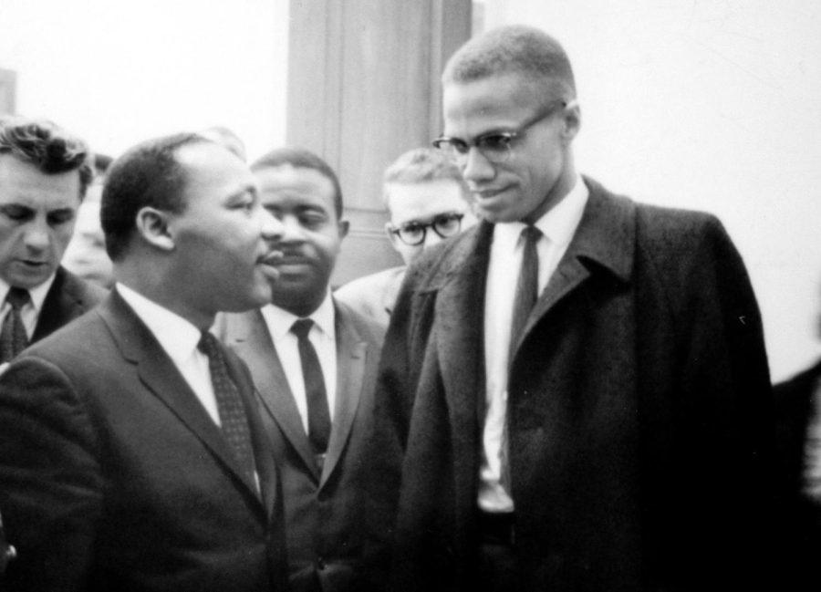 Civil rights leaders Martin Luther King Jr. and Malcom X are shown in a meeting during the 1960s.