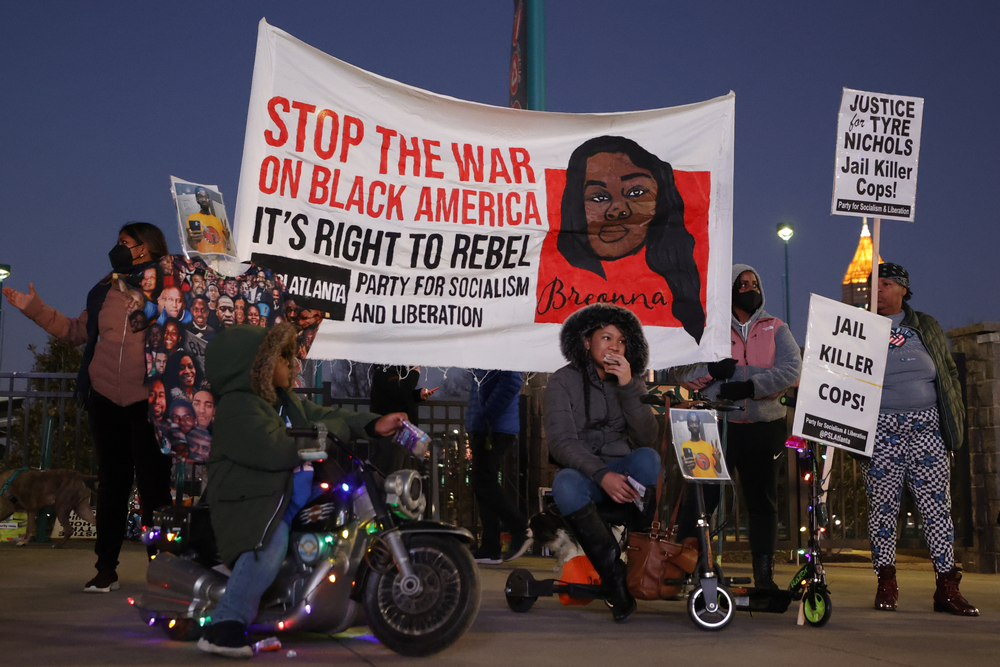 Demonstrators gather during a protest over the death of Tyre Nichols, Friday, Jan. 27, 2023, in Atlanta. (AP Photo/Alex Slitz)