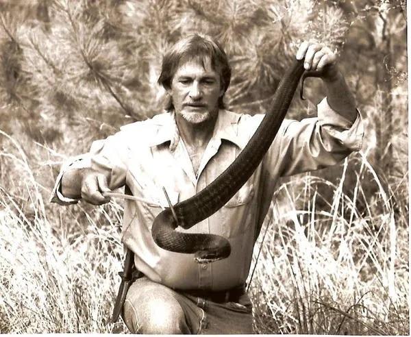 Man holding snake.