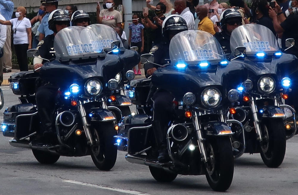 A quartet of police officers on motorcycles 