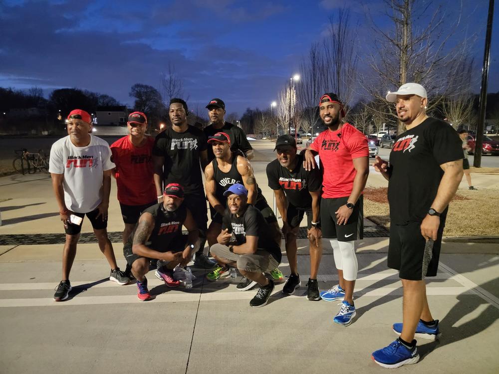 Members of Atlanta's Black Men Run pose for a photo after an event to honor Ahmaud Arbery in 2022.