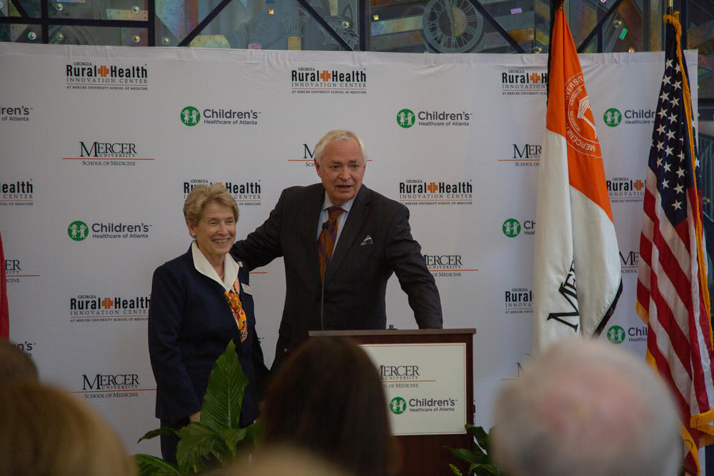 Dean of the Mercer School of Medicine, Jean Sumner, stands with university president William Underwood during the school's announcement of it's partnership with Children's Healthcare of Atlanta in Macon on Thursday.