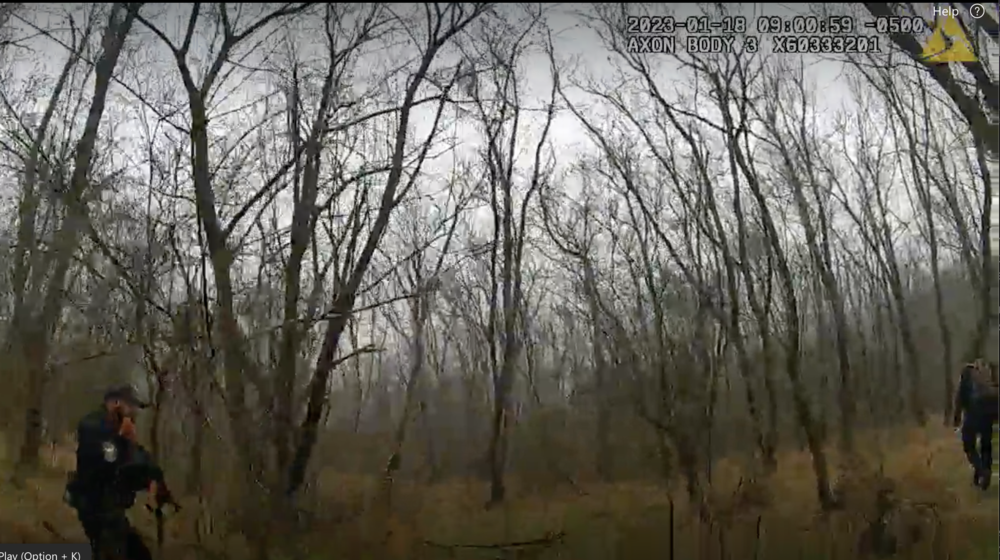 A video still shows members of law enforcement in the forest near the site of the planned police training facility in Atlanta on Jan. 18, 2023.