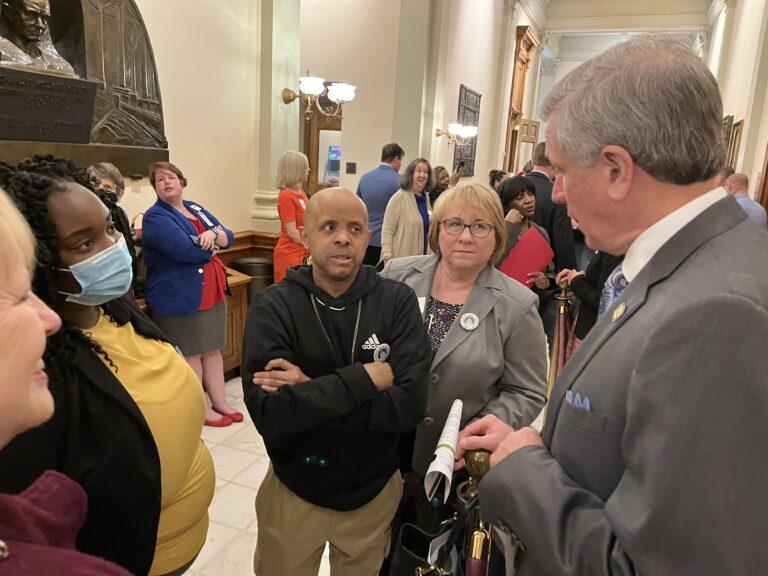 Tangeniqua Hopkins (left), a Fulton County direct-support professional, and Channing Bridges (center), who benefits from the county’s day programs, talks to Tyrone Republican Sen. Marty Harbin about the need to increase funding for both services and worker wages Thursday at the state Capitol. Jill Nolin/Georgia Recorder
