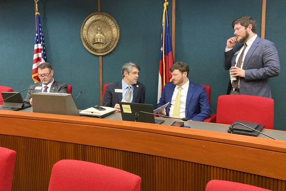 Georgia House Ways and Means Committee Chairman Shaw Blackmon, R-Bonaire, center left, talks to a staffer on Thursday, Feb. 16, 2023, at the Capitol in Atlanta. The committee passed bills to give taxpayers another $1 billion in income tax breaks and to ratify Gov. Brian Kemp's fuel tax suspension. 