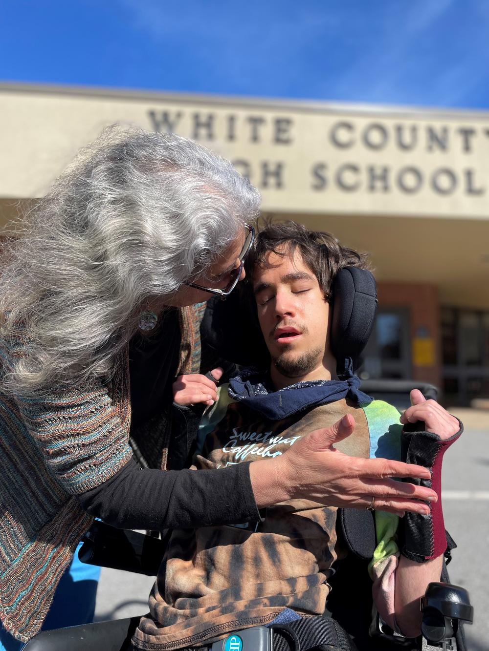 Jane Grillo and Joe Grillo outside White County High School