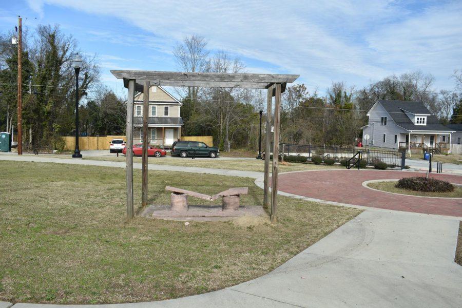 A broken bench in Jefferson Long Park. (Laura Corley | The Macon Newsroom)