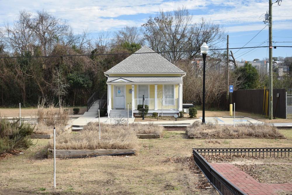 The neighborhood resource center on Craft Street next to Jefferson Long Park is one of the childhood homes of Little Richard. The door to the resource house was locked and the parking lot was empty on a recent Friday afternoon. A sign on the door urged visitors to scan a code to sign up for a museum tour online. (Laura Corley | The Macon Newsroom)