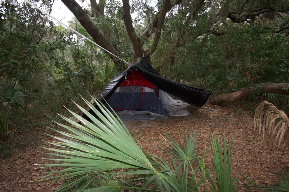 In mid-January, about a half-dozen tents, some with blankets and sleeping bags, were set up around Twin Palms. Credit: Stewart Dohrman