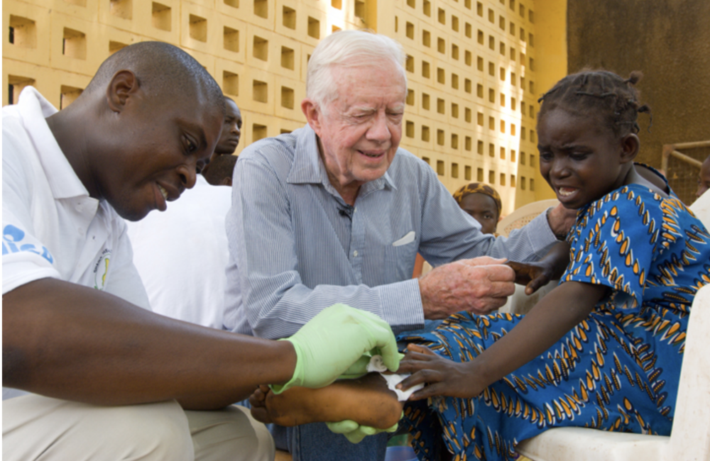 In Feb. 2007, former U.S. President Jimmy Carter tries to comfort 6-year-old Ruhama Issah at Savelugu Hospital in Ghana as a Carter Center technical assistant dresses Issah's extremely painful Guinea worm wound. In May 2010, with Carter Center support, Ghana reported its last case of Guinea worm disease and announced it had stopped disease transmission a year later. 