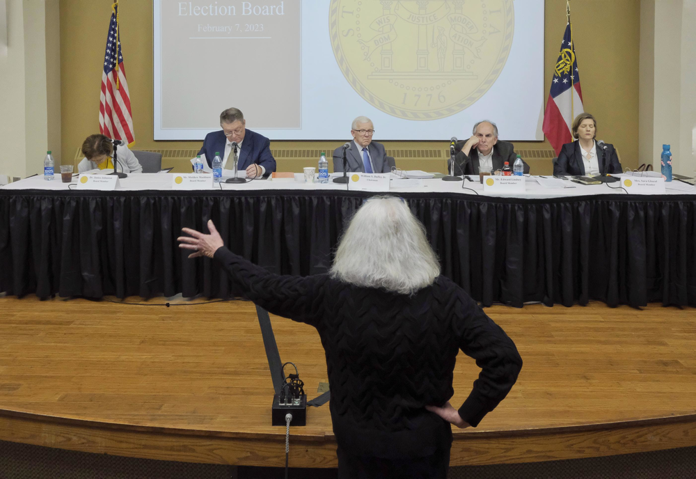 The Georgia Board of Election listens as Sarah Webster of Albany explains why she felt intimidated by Black Voters Matter volunteers and filed a complaint with the Secretary of State's office. Webster was the subject of her own complaint because she brought a gun into her polling place.