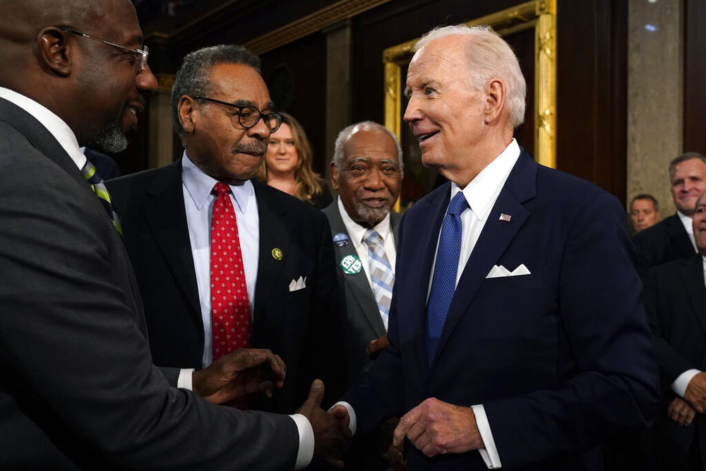 President Joe Biden shakes hands with Sen. Raphael Warnock, D-Ga., as Rep. Emanuel Cleaver, D-Mo., watches after the State of the Union address to a joint session of Congress at the Capitol, Tuesday, Feb. 7, 2023, in Washington. (Jacquelyn Martin, Pool)