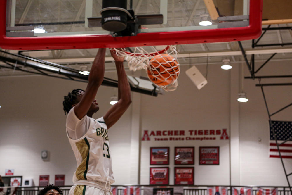 Grayson High School basketball player dunks