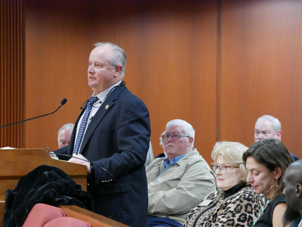  Rep. John Corbett, a Lake Park Republican, speaks against a bill that would ban future mining applications at Trail Ridge near the Okefenokee Swamp as the bill sponsor, Rep. Darlene Taylor, sits to his left. Jill Nolin/Georgia Recorder