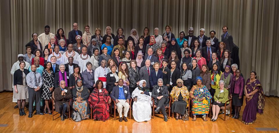 Jimmy and Rosalynn Carter stand with human rights defenders at a March 2015 forum at the Carter Center.