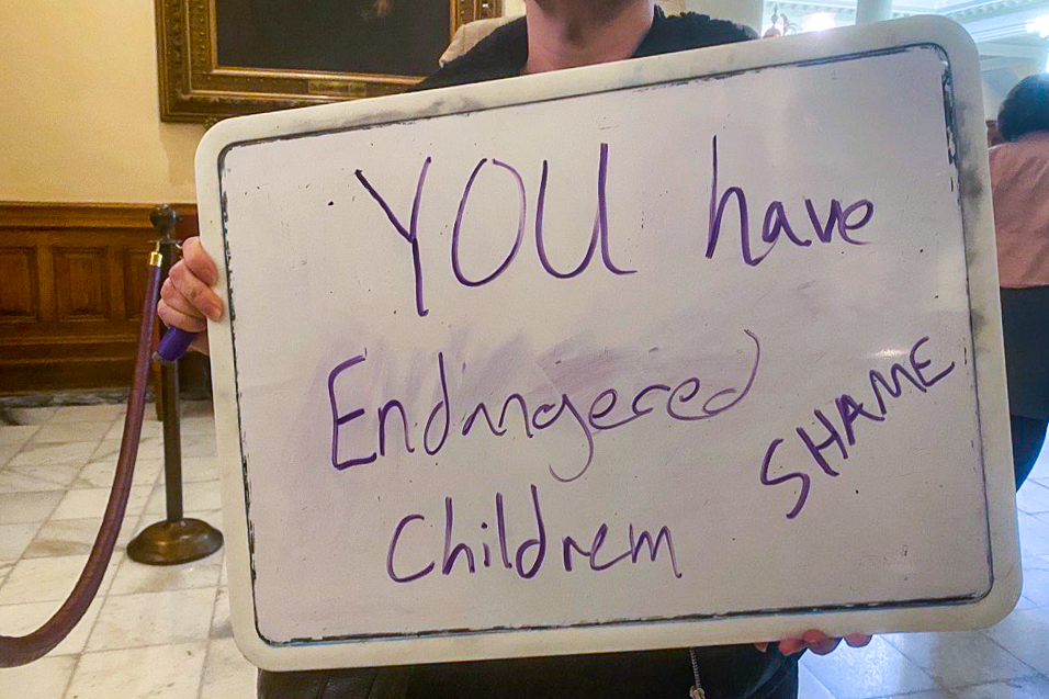 Opponents of SB 140 stood outside of the Senate chamber while senators voted.