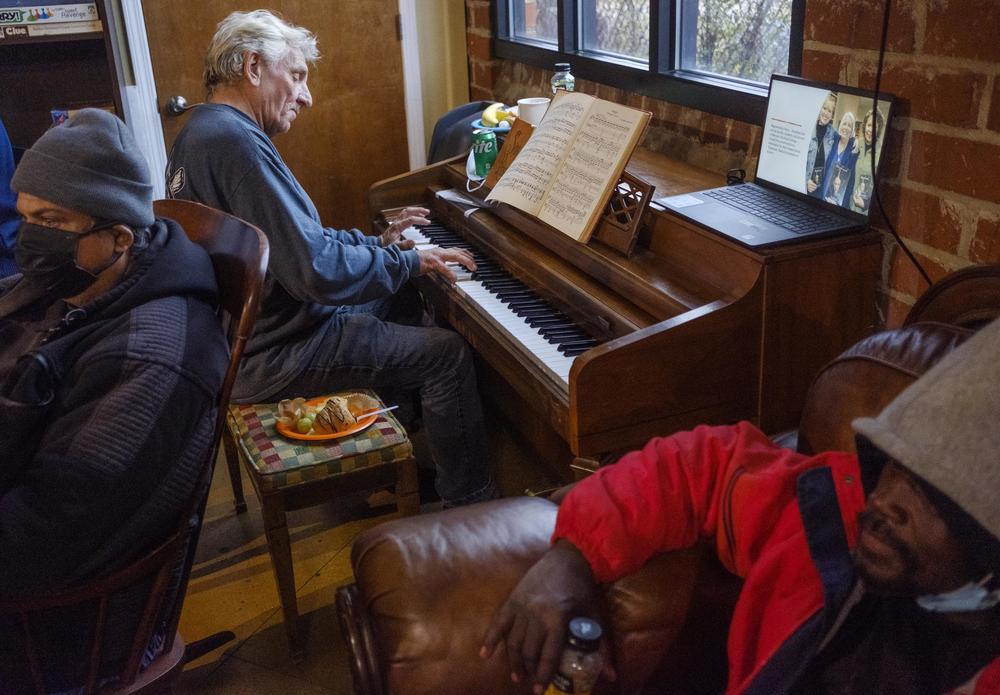 Randy Bedingfield plays the piano in a corner of the Daybreak Homeless Day Center in Macon in 2022. Daybreak is privately fun