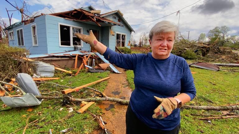 Sherry Bennett gestures at her home in Troup County, Ga., on March 27, 2023, hours after it was destroyed by a tornado.