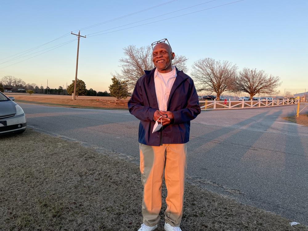 Man standing in sunset.