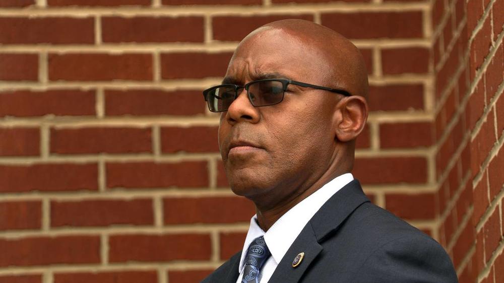 Columbus Police Chief Freddie Blackmon listens to a speaker during a Tuesday evening rally outside the City Services Center prior to Tuesday night’s Columbus Council meeting.  Read more at: https://www.ledger-enquirer.com/news/local/crime/article273988815.html#storylink=cpy