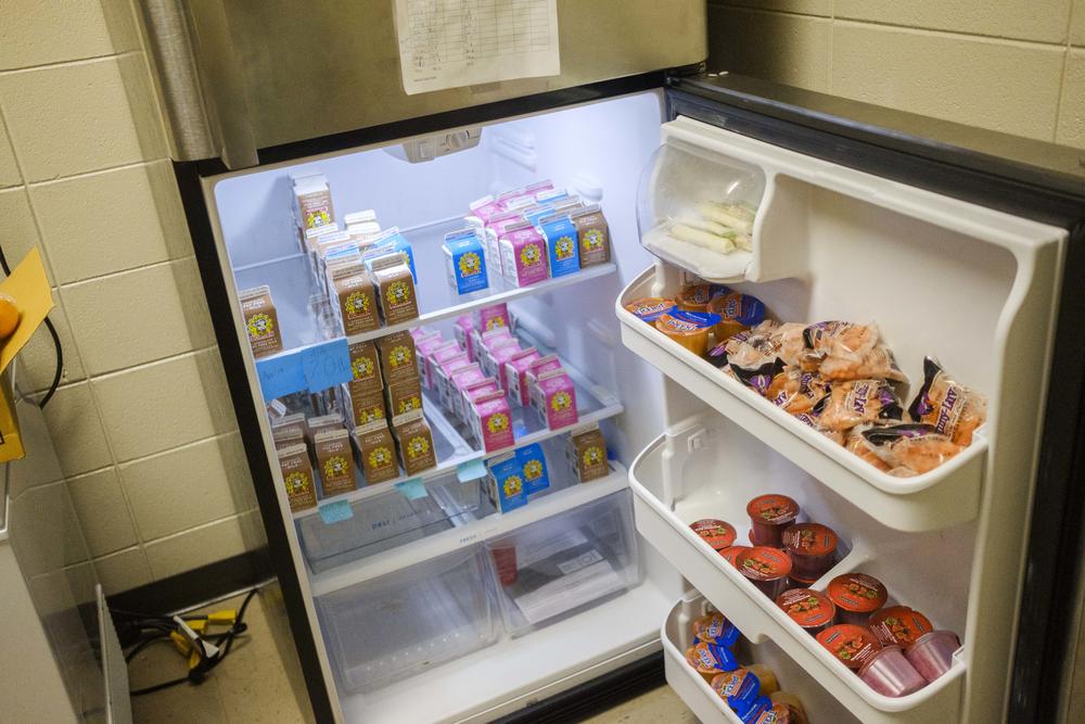 A refrigerator at Ballard Hudson Middle School stocked with food that would have otherwise gone from school lunch trays and into the trash, now slated to be sent home to feed students on the weekend. 