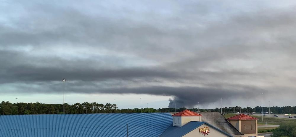 Pinova fire smoke spreading just before dark on Saturday. Credit: Ed GaNun