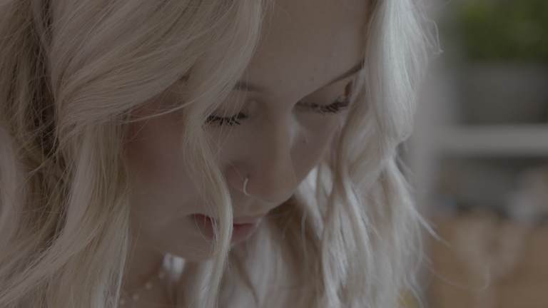 Close-up shot of a blonde woman.