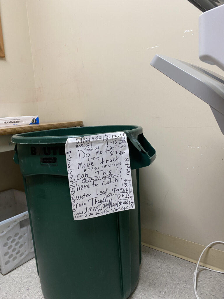 A Georgia Gwinnett College copy room features a trash can dedicated to collecting water from a leaky ceiling. Prof. Jill Penn said she took the photo April 6, 2023, but the bucket has been collecting droplets since 2019. Photo via Jill Penn.