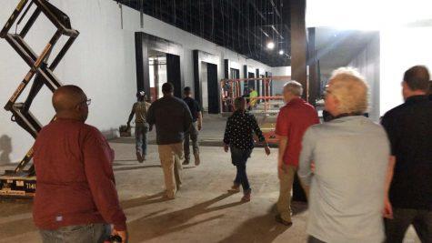 Board of Elections members and staff walk to the new office in Macon Mall, which is about 175 yards from the nearest handicapped parking space.