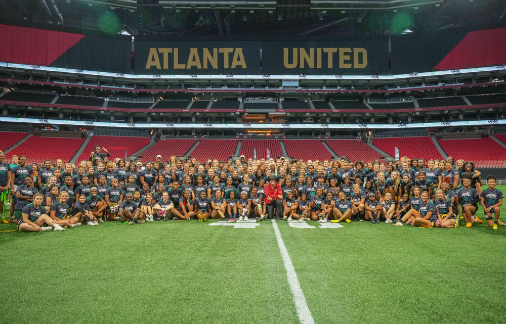 All of the participants in the 2023 High School Girls Flag Football Showcase at Mercedes-Benz Stadium.