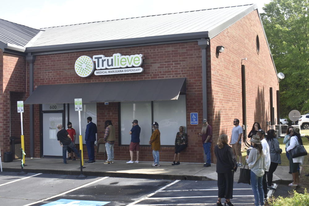 Customers line up outside the Marietta Trulieve store on its first day of operation. 