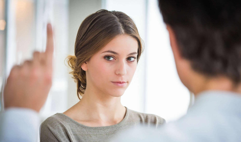 A woman follows a therapist's finger during EMDR treatment