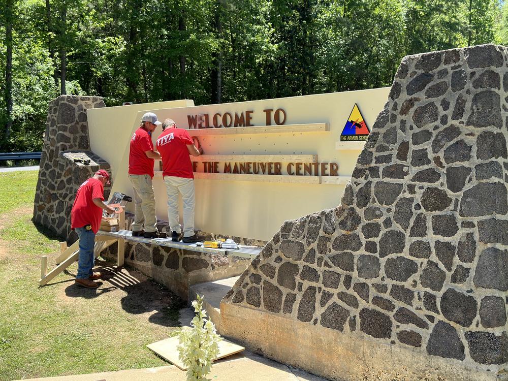 The sign on the stone gate of the Army's training hub in Georgia is changed from ⁦Fort Benning ⁩to Fort Moore in honor of Lt. Gen. Hal Moore and his wife, Julia.