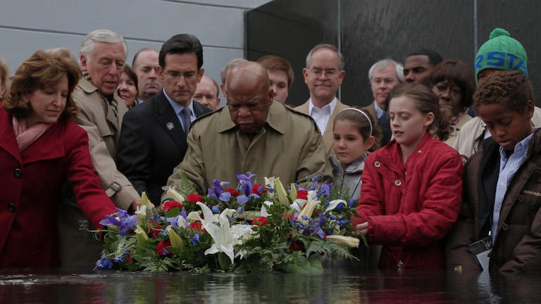 Congressman John Lewis participates in a ceremony.