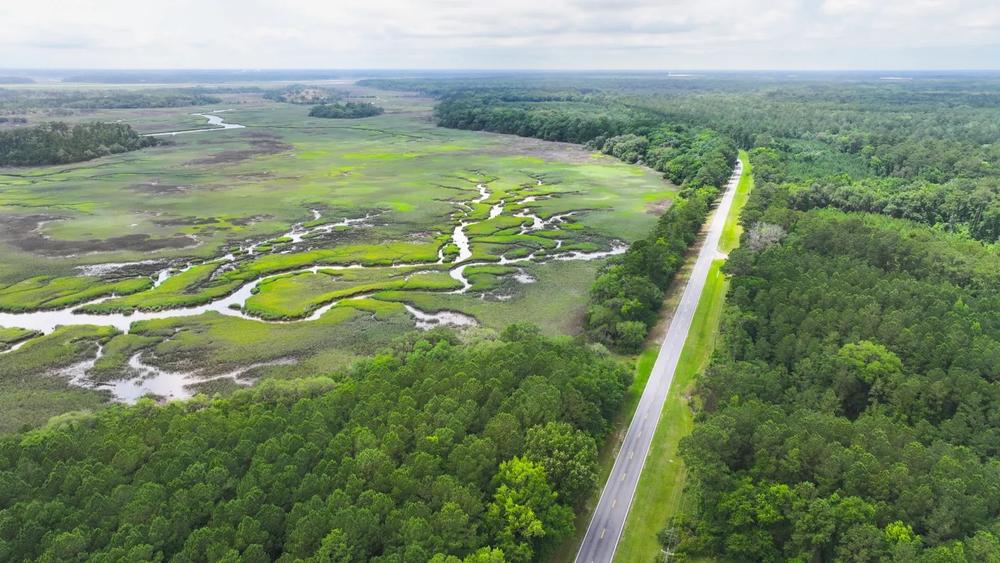  The two-lane Islands Highway is the only way in or out of East Liberty. Residents have expressed fears that rapid warehouse development will create excessive traffic and public safety delays on Islands Highway. Credit: Justin Taylor/The Current