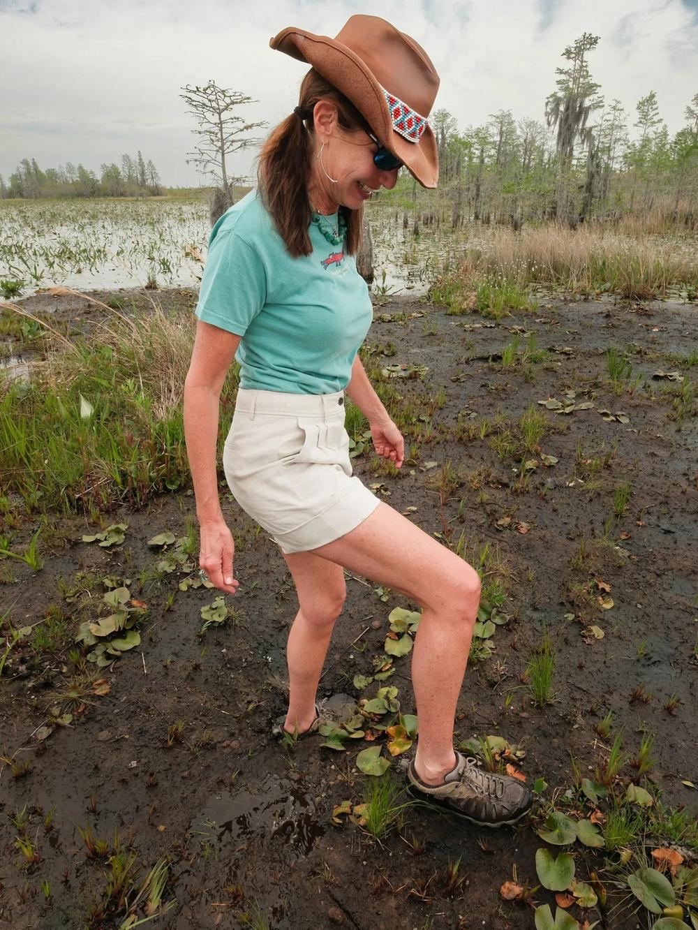 Rena Peck, executive director of the Georgia River Network, trods the “trembling earth” of a peat battery in the Okefenokee National Wildlife Refuge Credit: Justin Taylor