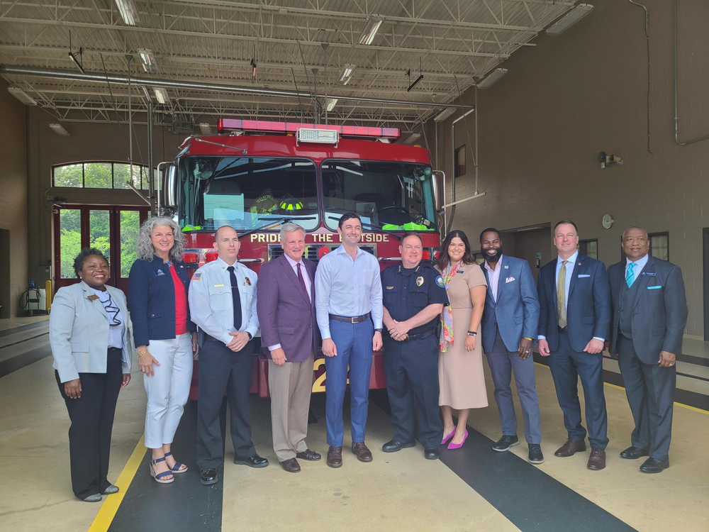 U.S. Sen. Jon Ossoff meets with officials on May 22, 2023 in Roswell, Ga. to announce the Helper Act, a bill to help public servants buy homes where they live.