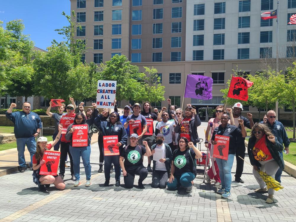 Members of the Starbucks Workers Union gathered at the Starbucks regional office in Atlanta on May 1, 2023, to demand better working conditions.