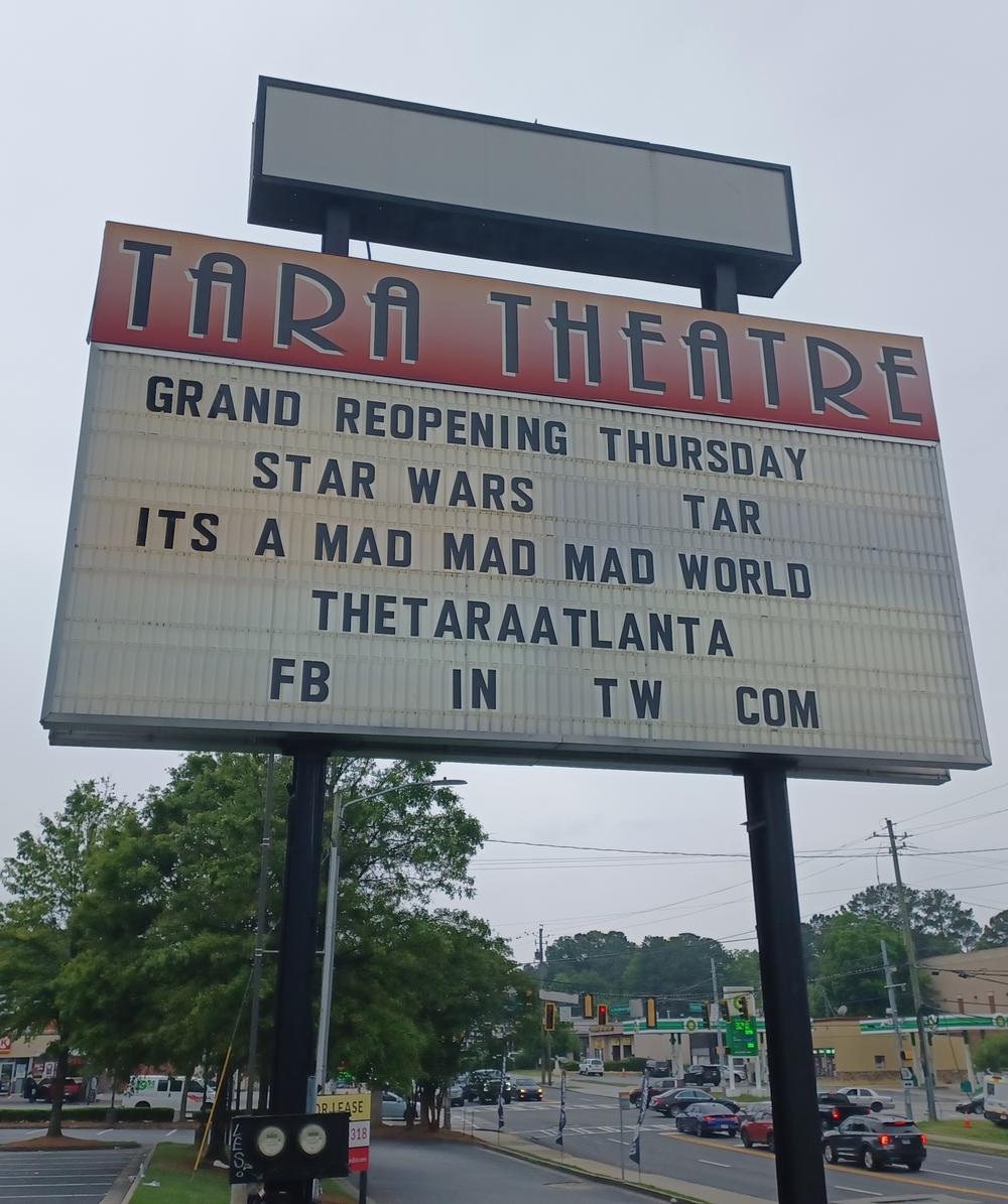The marquee is shown that says "Tara Theatre" followed by a list of movies.
