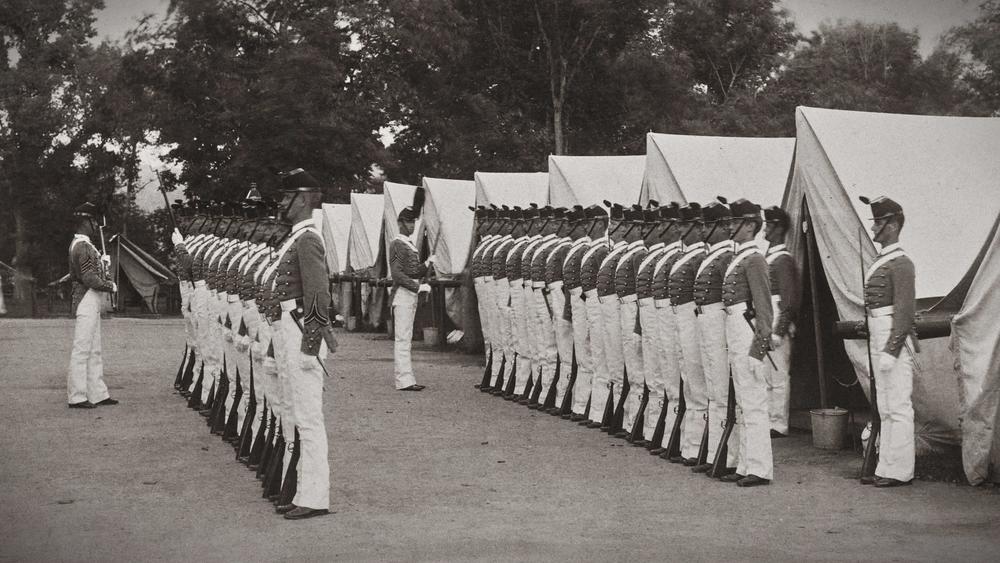 Cadets in tents and inspection; 1889 class yearbook from West Point.