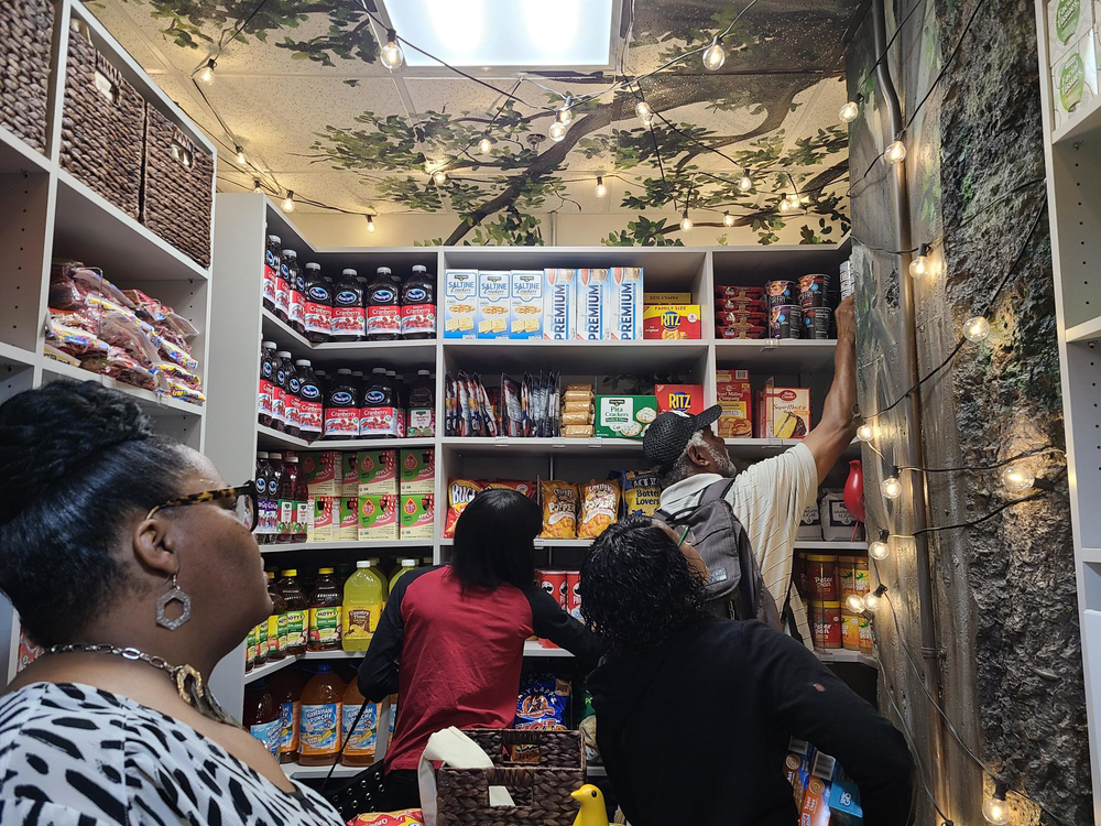 Fulton County families make the first bags after the County Clerk office held a ribbon-cutting for its new food pantry June 12, 2023.