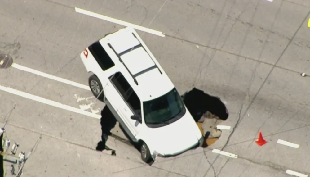 An SUV fell into a large sinkhole on Ponce de Leon 