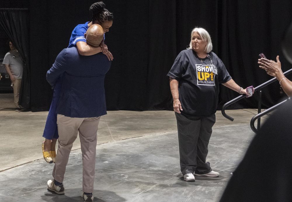 Vineville Academy teacher Kimberly Barton is lifted off her feet by her husband Jonathan after being named Bibb County School's Teacher of the Year. "She puts her heart in it," Jonathan Barton said of his wife's chosen career. "I see it everyday."