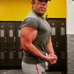 Robert Lyle, a Georgia long-hauler and former fitness coach, posing at the gym prior to the pandemic. 