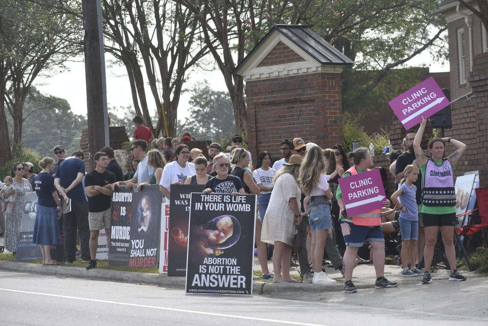 Anti-abortion protesters gather outside A Preferred Women’s Health Center of Atlanta in Forest Park.