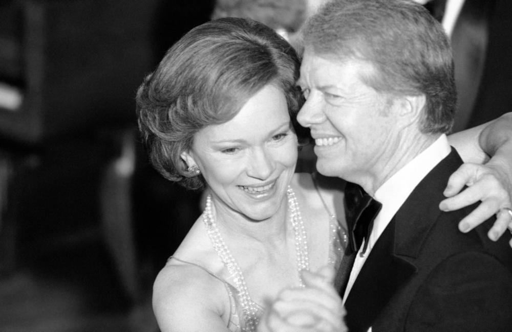 In this Dec. 13, 1978, file photo, President Jimmy Carter and his wife Rosalynn lead their guests in dancing at the annual Congressional Christmas Ball at the White House in Washington. Jimmy and Rosalynn are celebrating their 77th wedding anniversary, Friday, July 7, 2023.