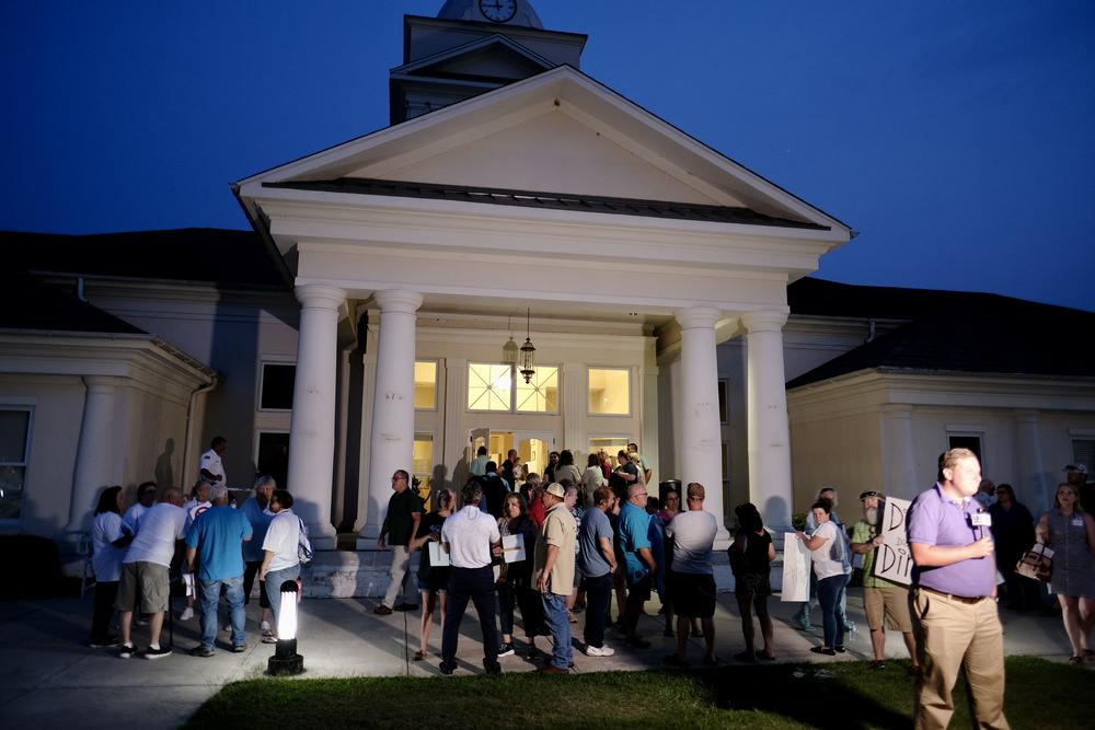 Community members gather outside the Crawford County courthouse