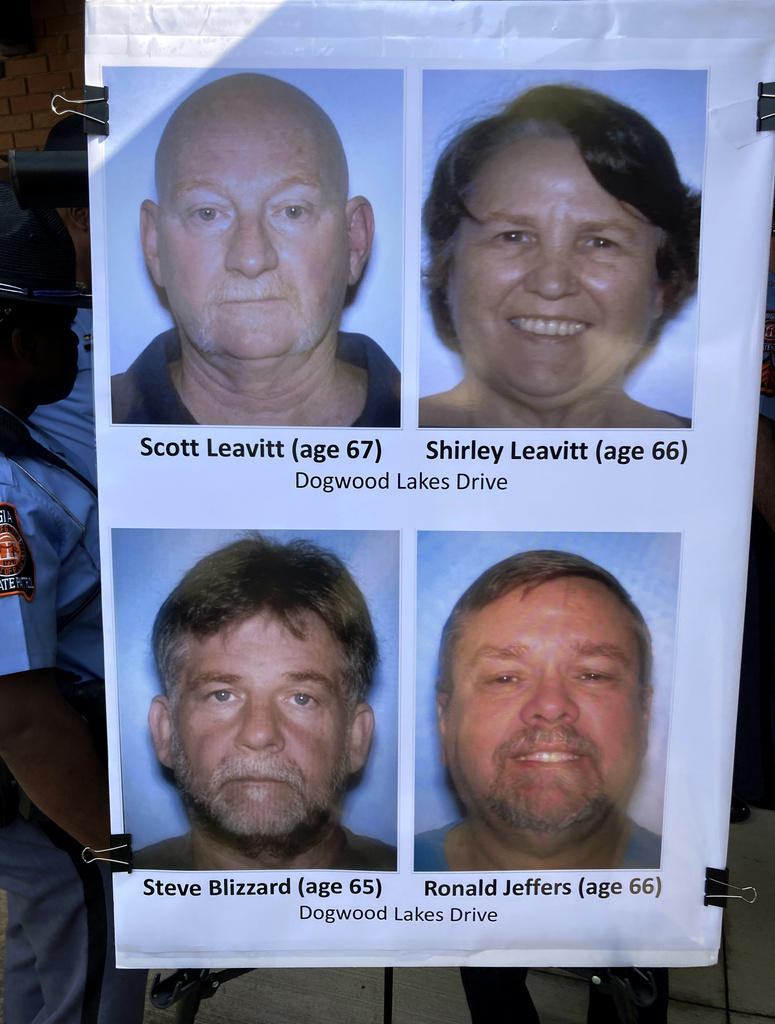 Pictures identifying the four people shot and killed in Saturday's shooting near Atlanta are displayed by officers, Sunday, July 16, 2023, in Hampton, Ga. 